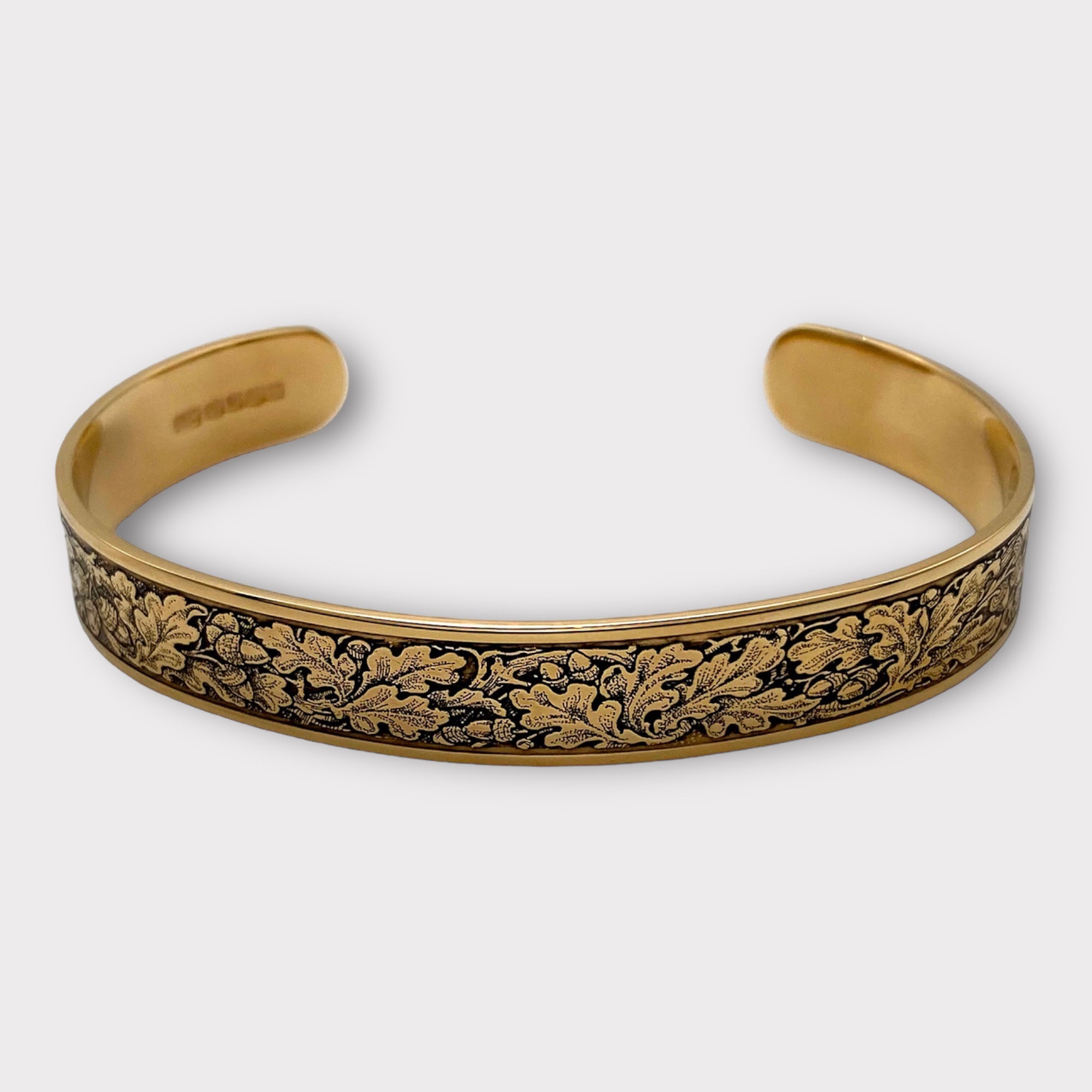 Engraved gold vermeil bangle bracelet filled with oak leaves in gun engraving style from Ken Hunt